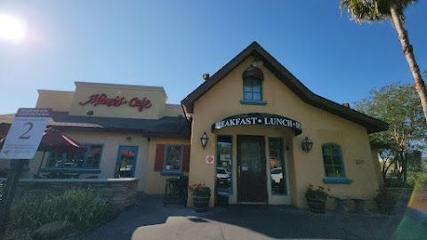 A yellow building with a sign that says breakfast lunch