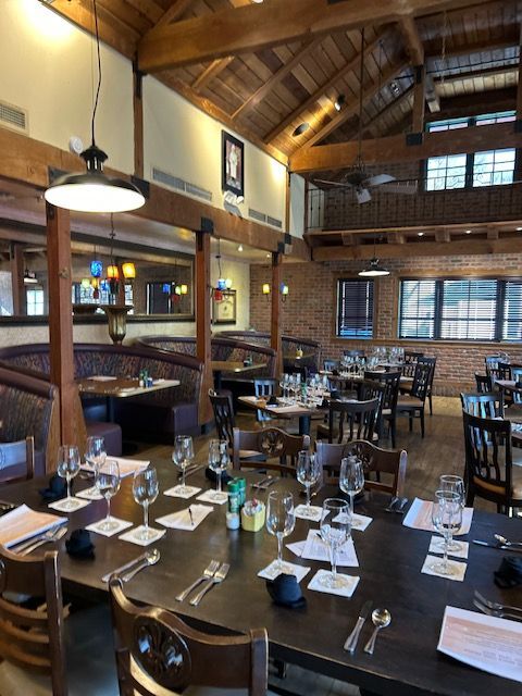 A restaurant with a lot of tables and chairs