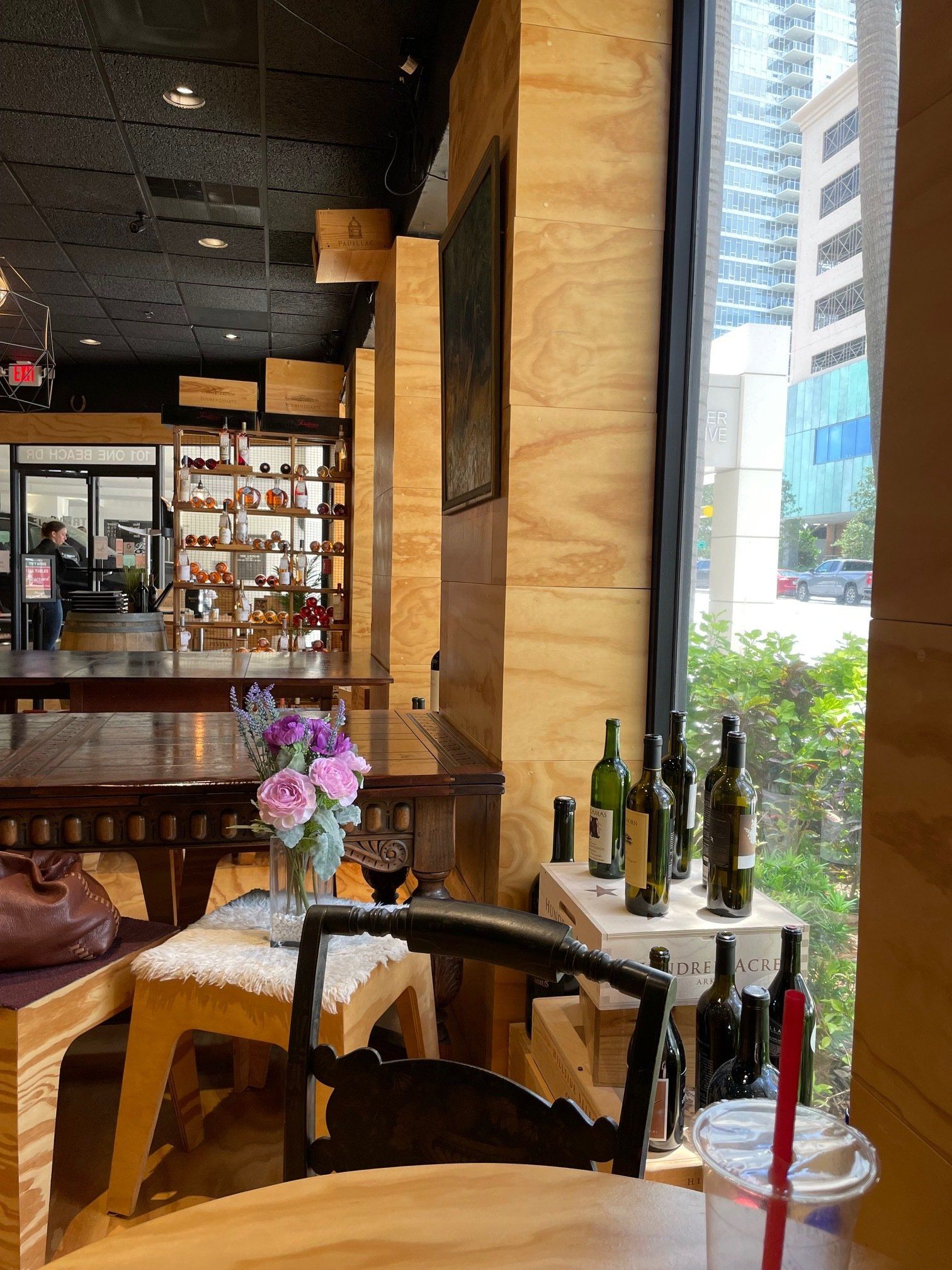A table in a restaurant with bottles of wine on it