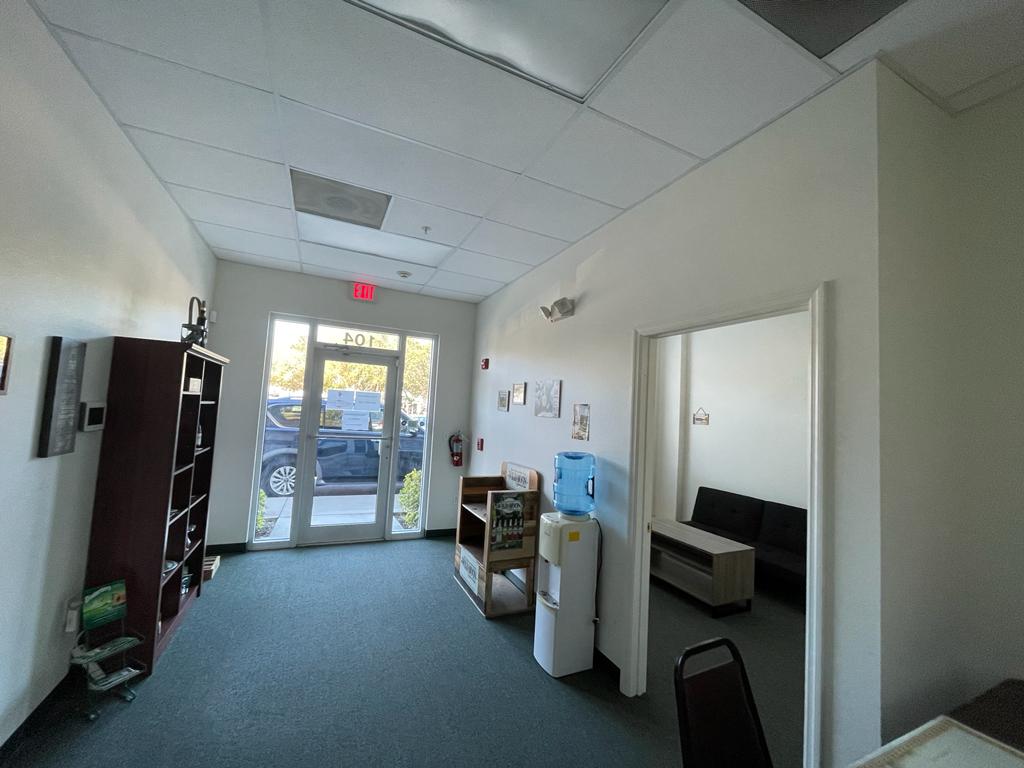There is a water dispenser in the middle of the room.