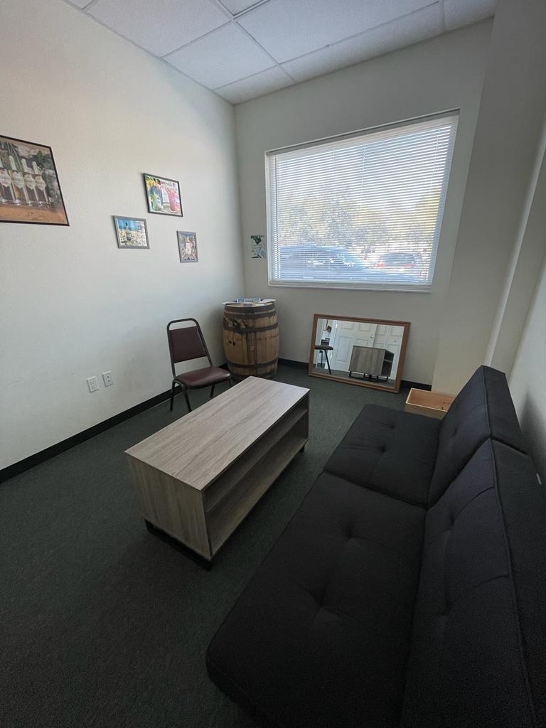 A living room with a couch and a coffee table