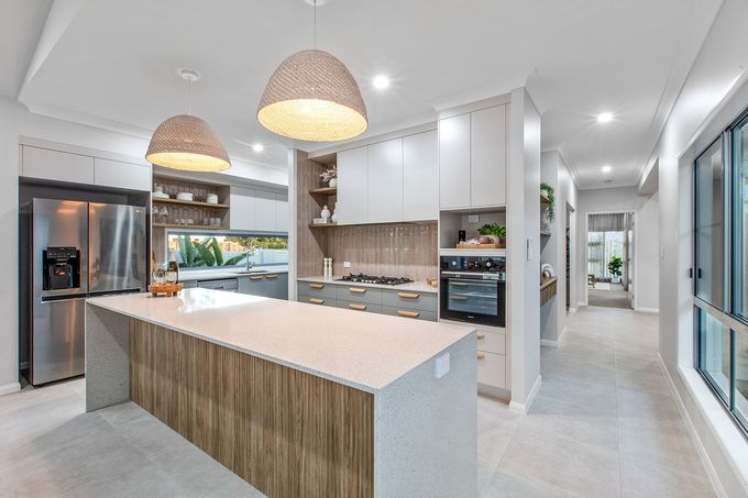 Custom kitchen with stone island bench, white and timber cabinetry, and open shelving designed by cabinet makers in Mackay