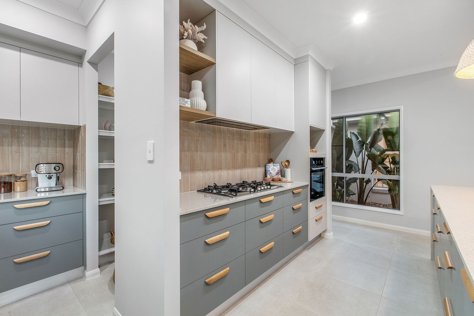 Kitchen With White Cabinets And Light Wood Handles — City Cabinetmakers in Mackay, QLD