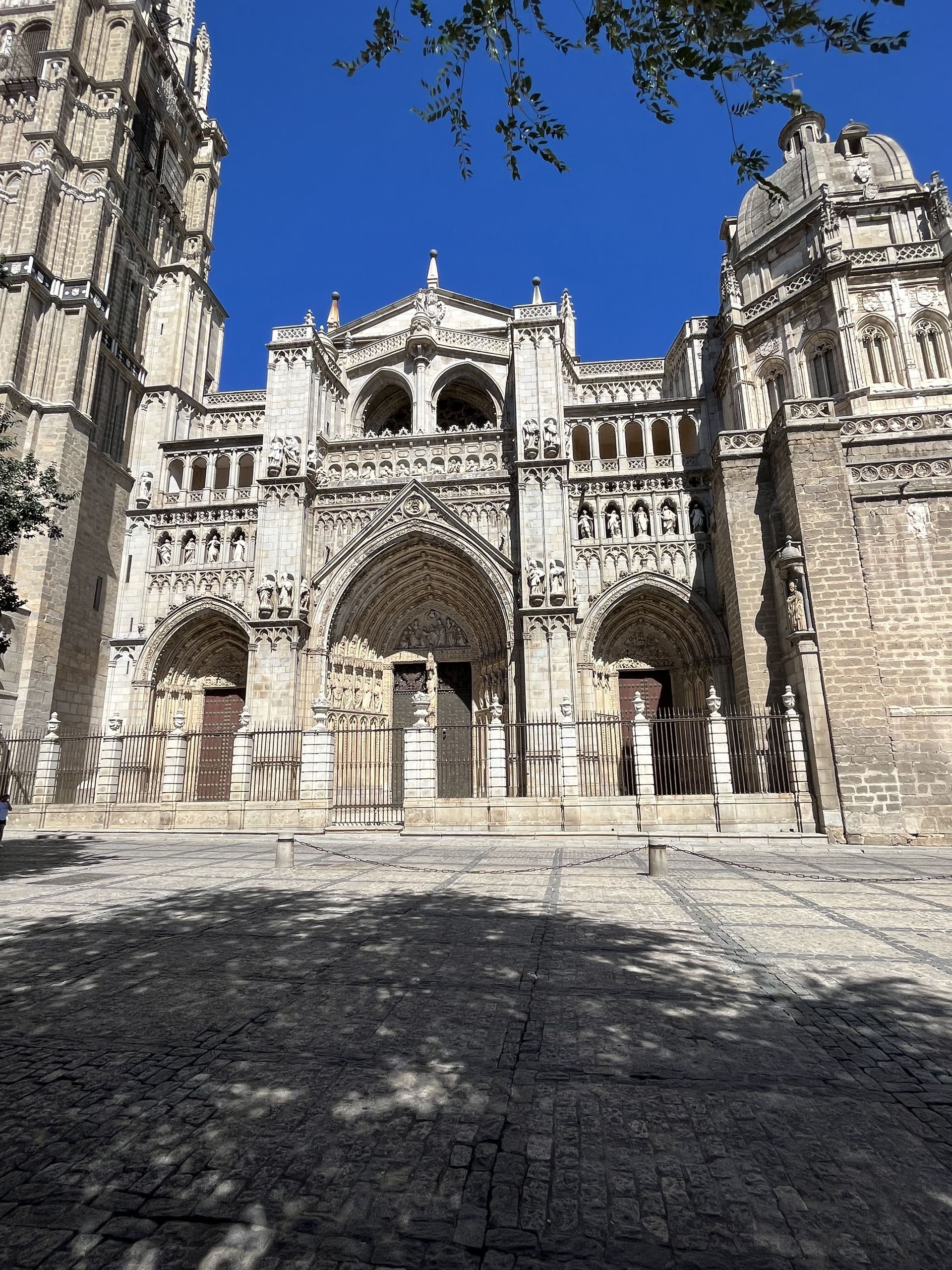 A large stone building with a blue sky in the background