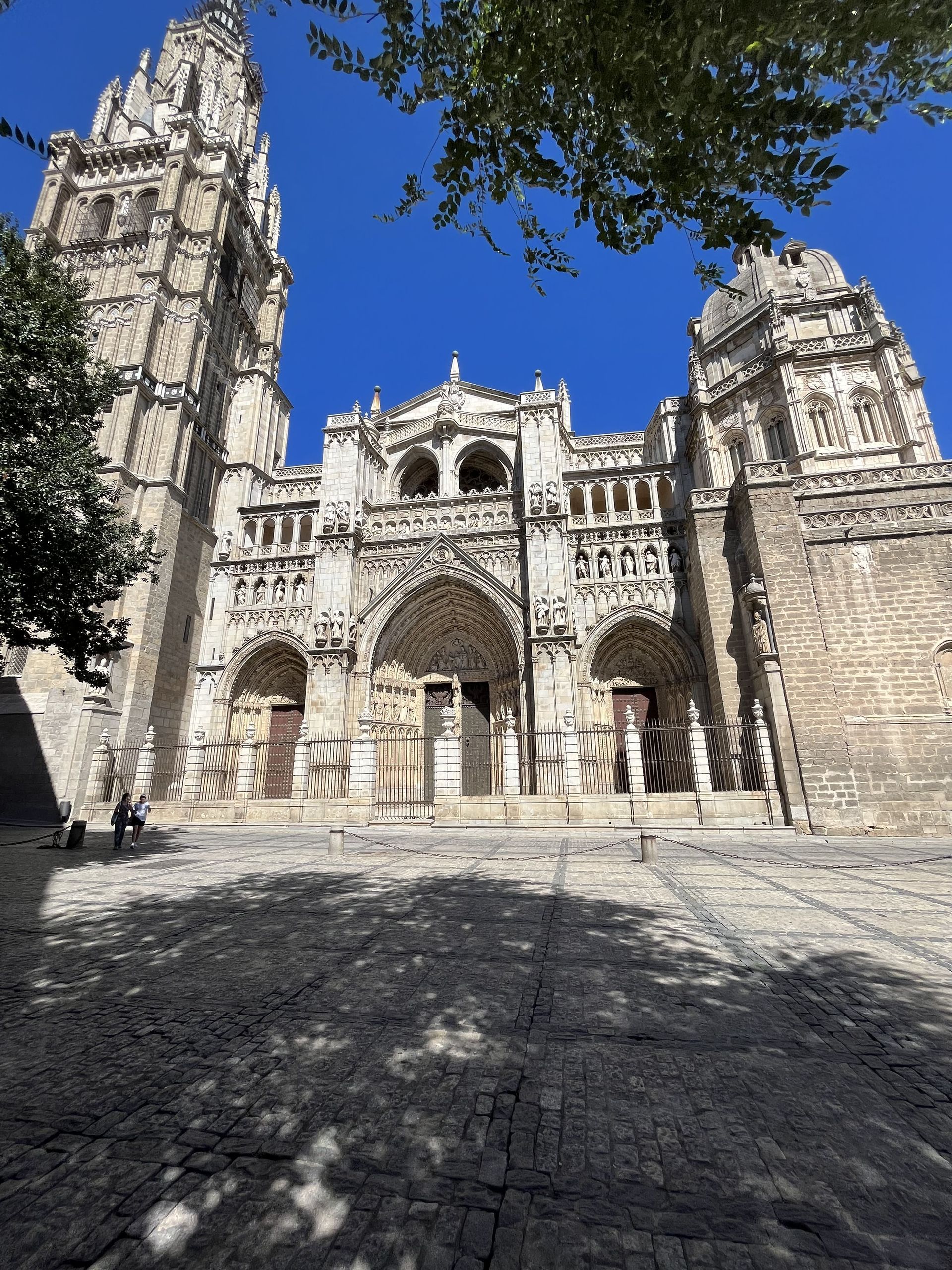 A large brick building with a blue sky in the background