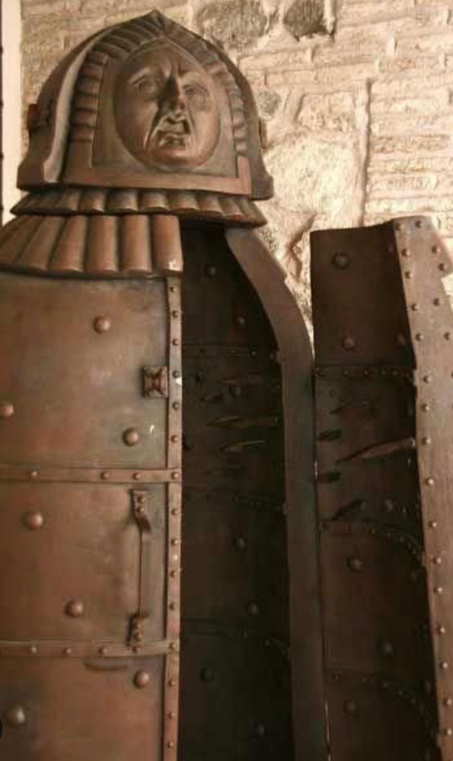 A metal object with a face on top of it