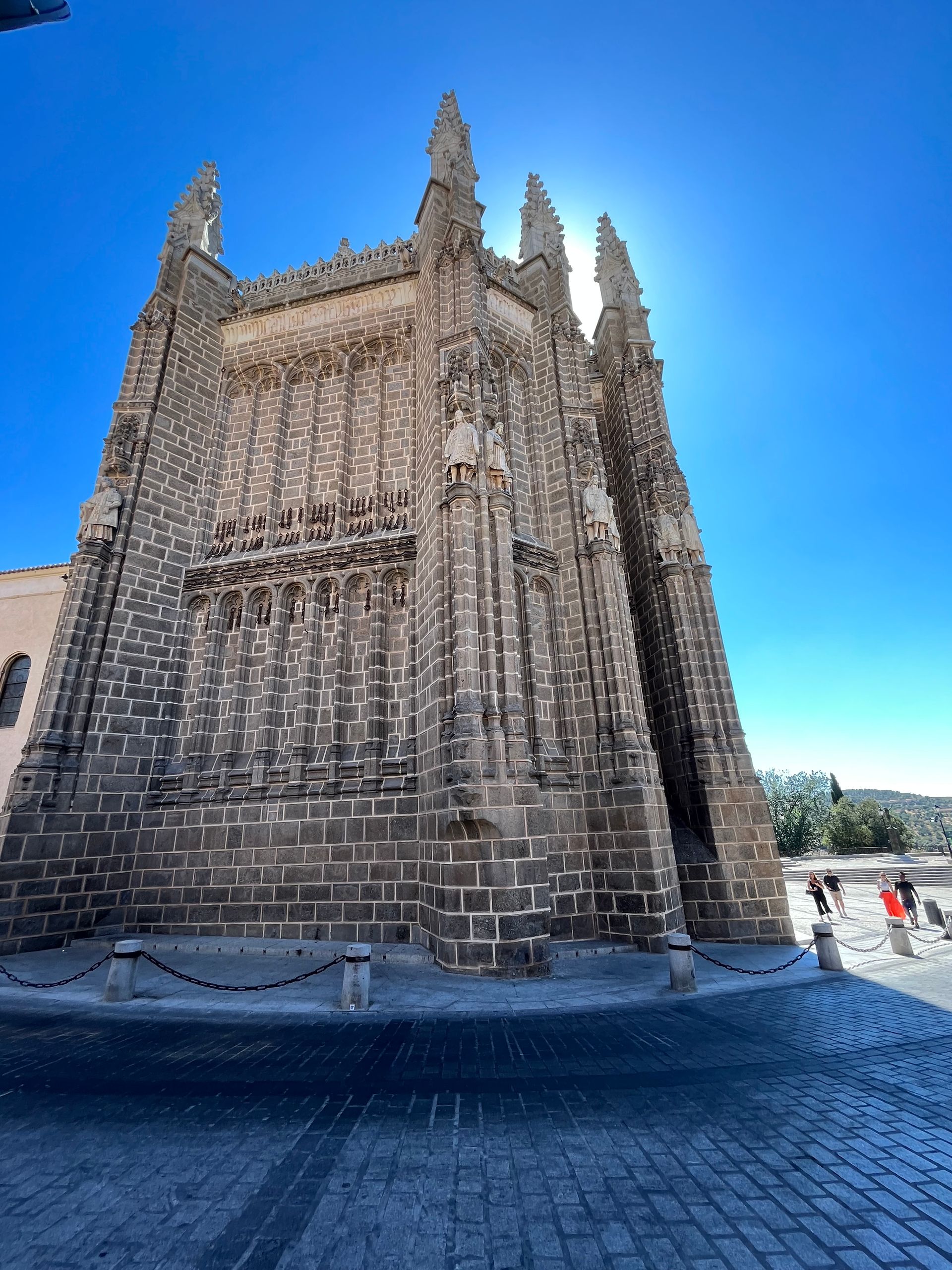 A large brick building with a blue sky in the background