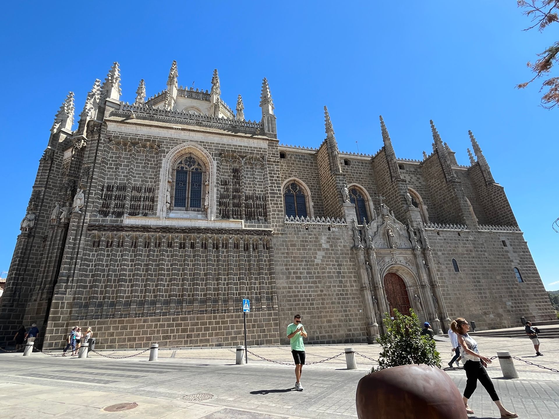 A large stone building with a blue sky in the background