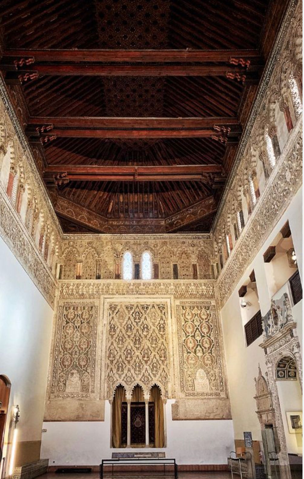 A large room with a wooden ceiling and walls