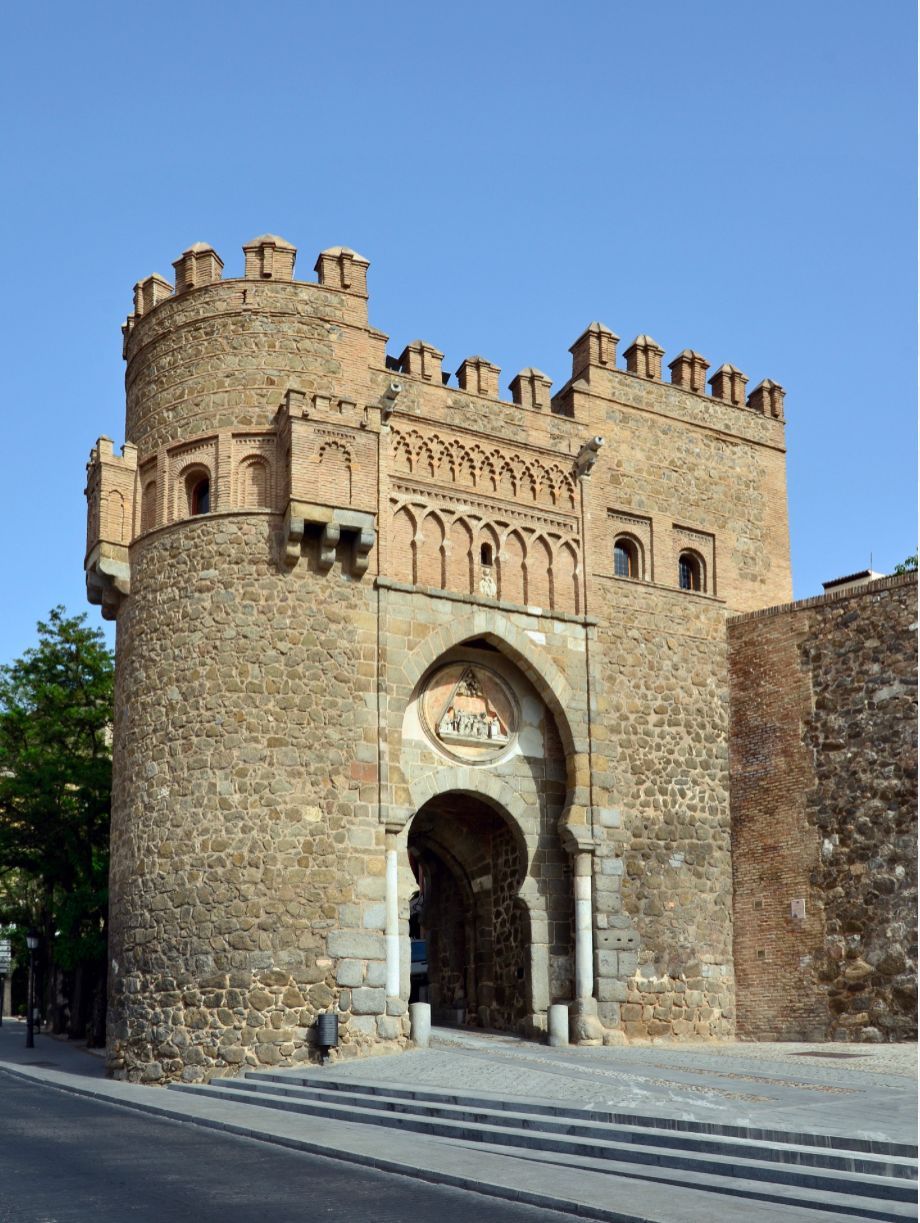 A large stone building with a doorway in the middle of it