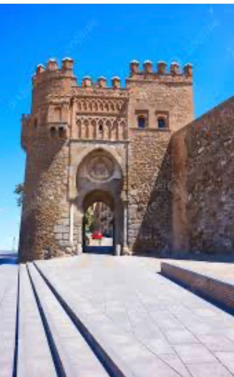 A stone building with stairs leading up to it
