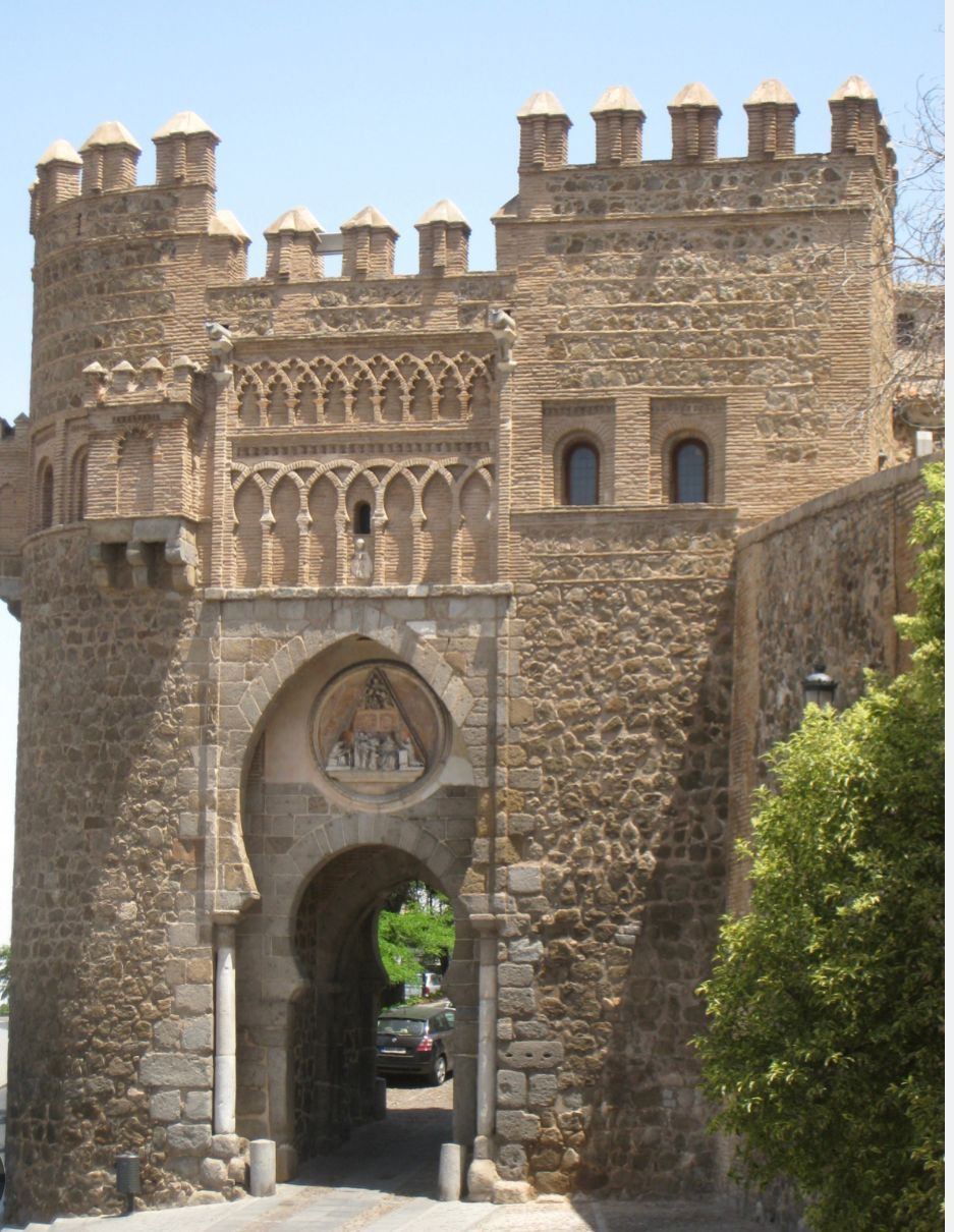 A very old stone building with a large archway
