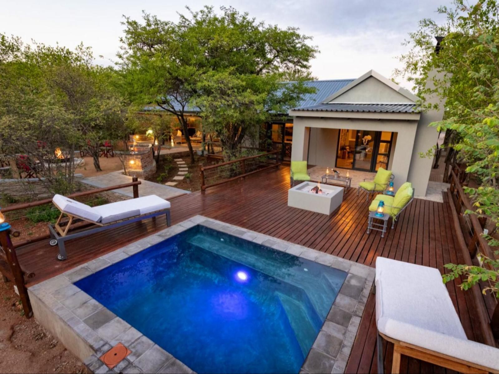 a house with a swimming pool in front of it