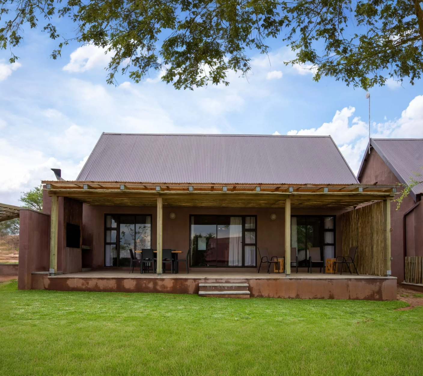 the back of a house with a covered porch