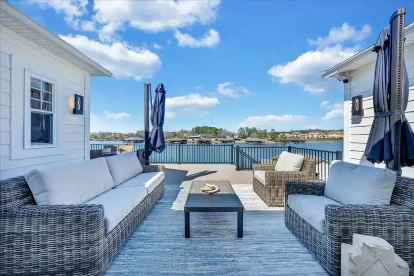 Waterfront deck with outdoor seating and lake view