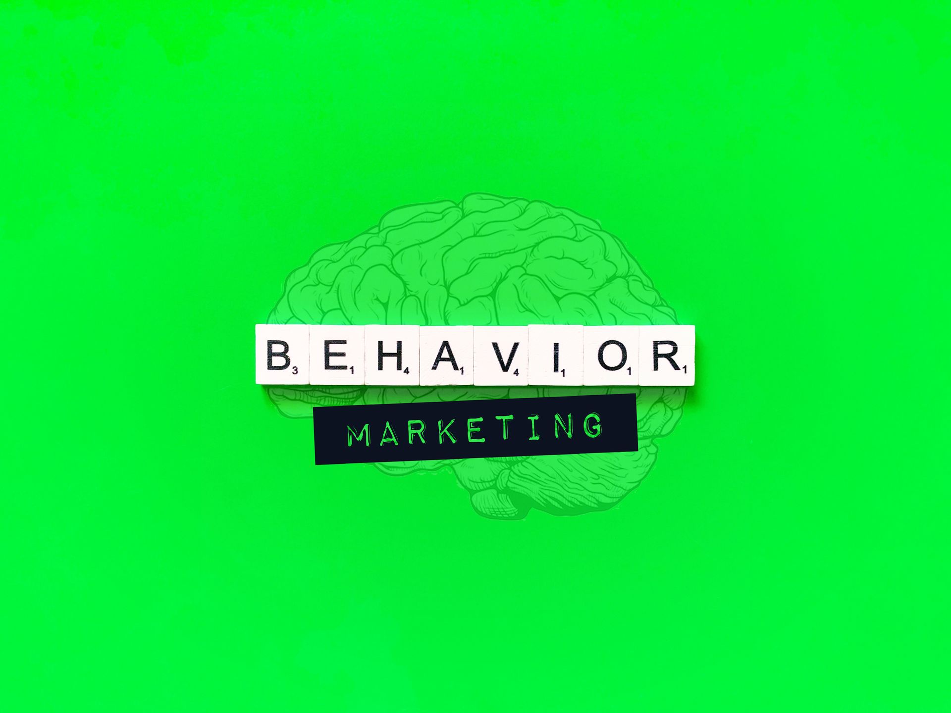 um cérebro verde com as palavras marketing comportamental escritas nele.