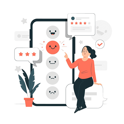 Una mujer estå sentada en un bloque frente a un teléfono celular.