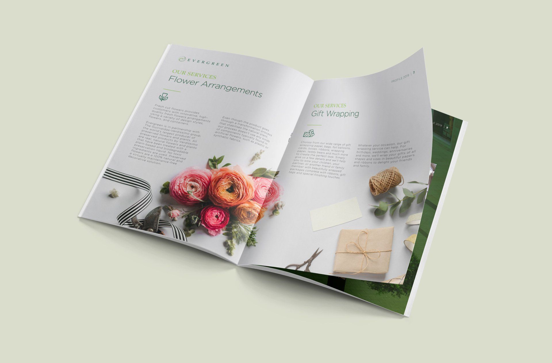 Open magazine spread with floral arrangement and gift box. Light background, green accents.