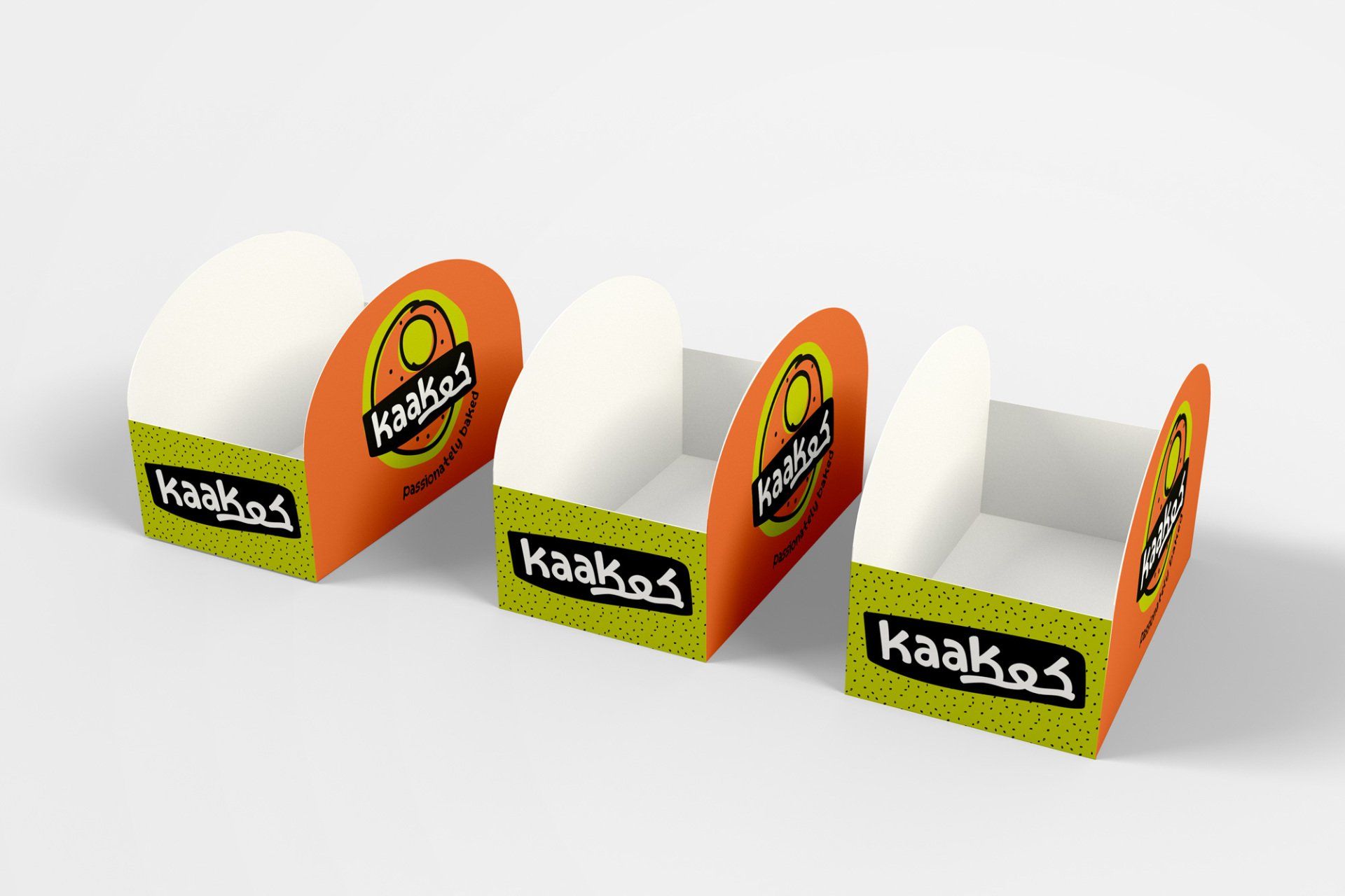 Three orange and green cardboard display boxes with 