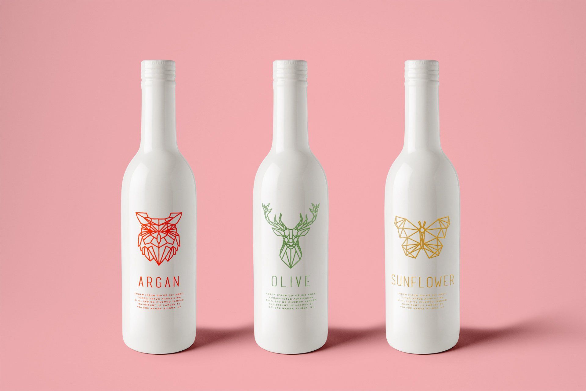 Three white bottles with animal-themed labels: an owl (red), a deer (green), and a butterfly (gold), on a pink background.
