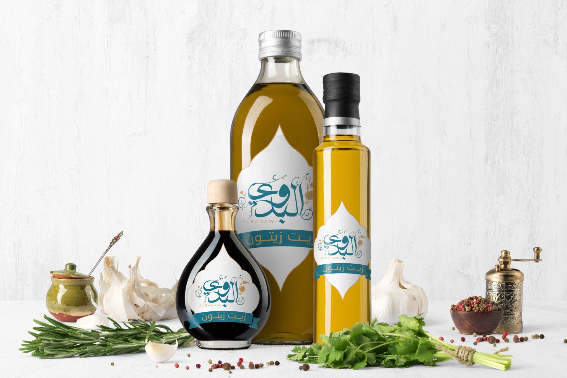 Bottles of oil and vinegar with Arabic labels, surrounded by herbs, garlic, and spices.