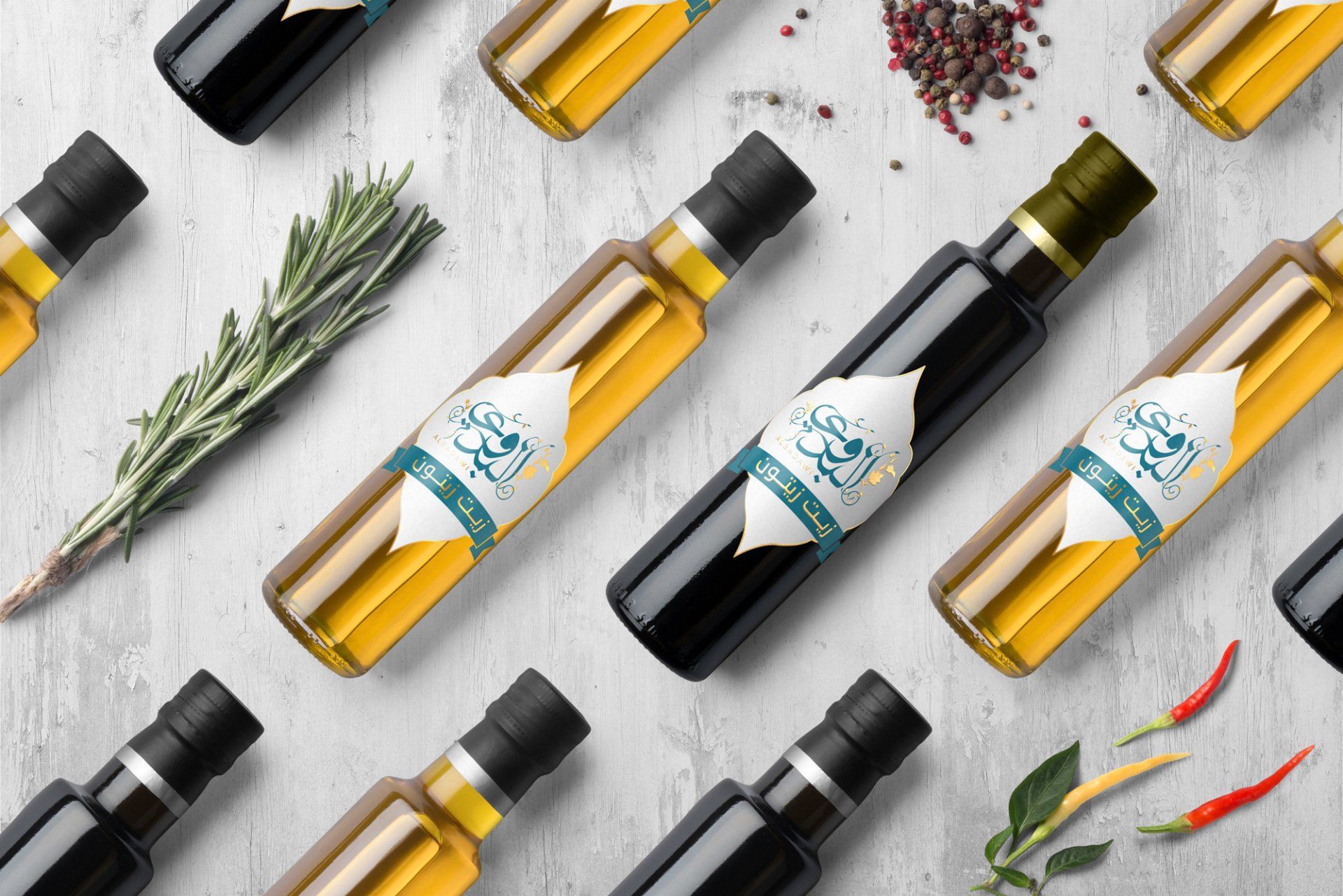 Bottles of oil and vinegar with Arabic labels on a textured surface, along with herbs and spices.