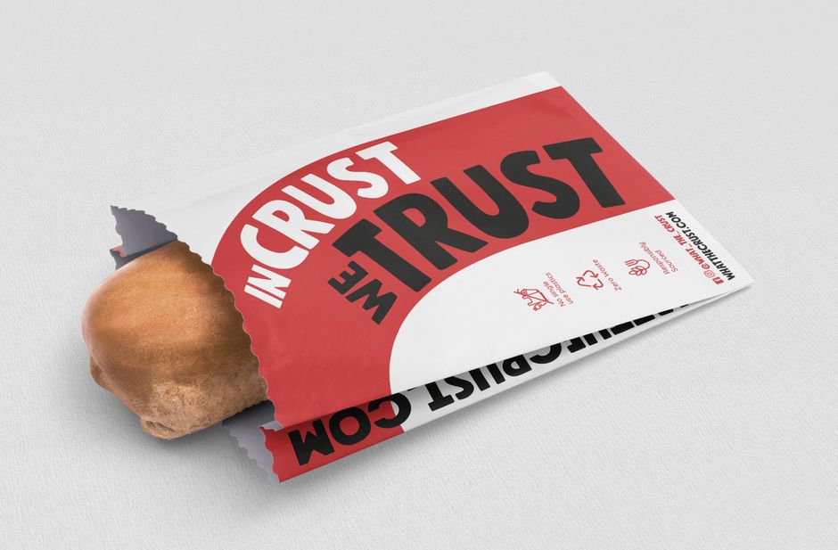 Bread roll in a white bag with red stripe and 