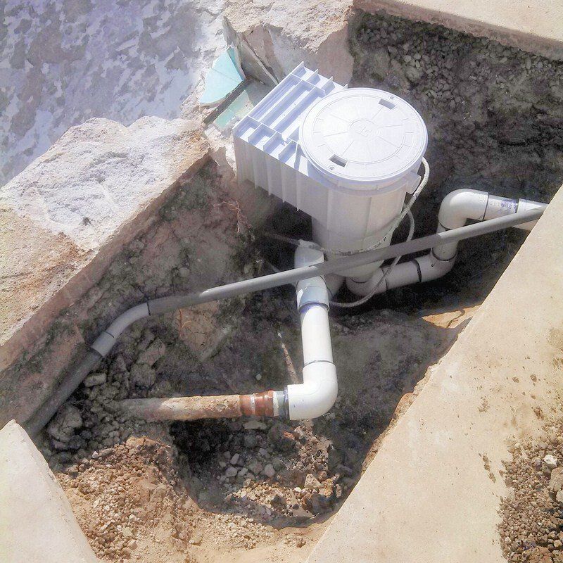 A pool skimmer being installed