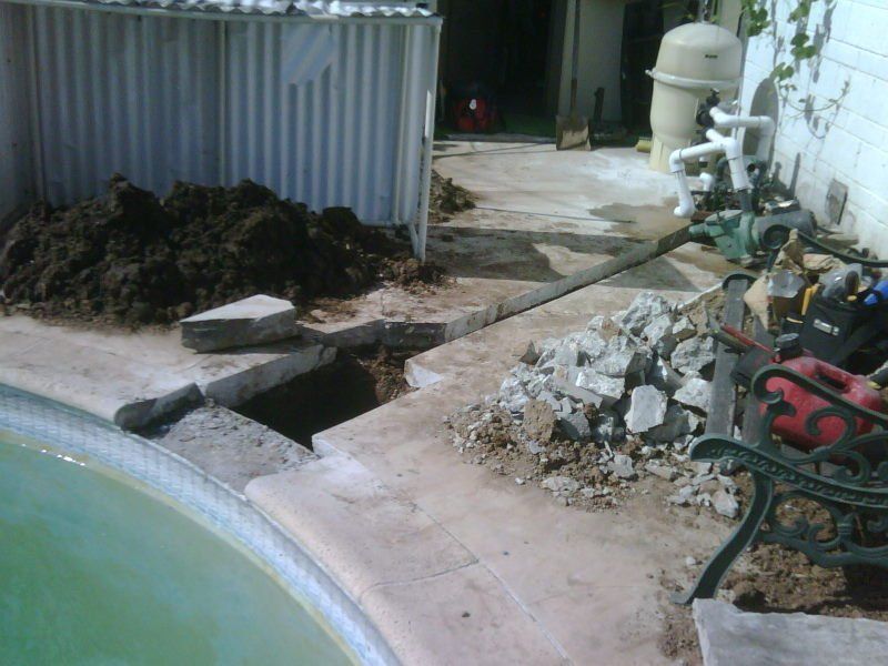 A new pool skimmer being installed