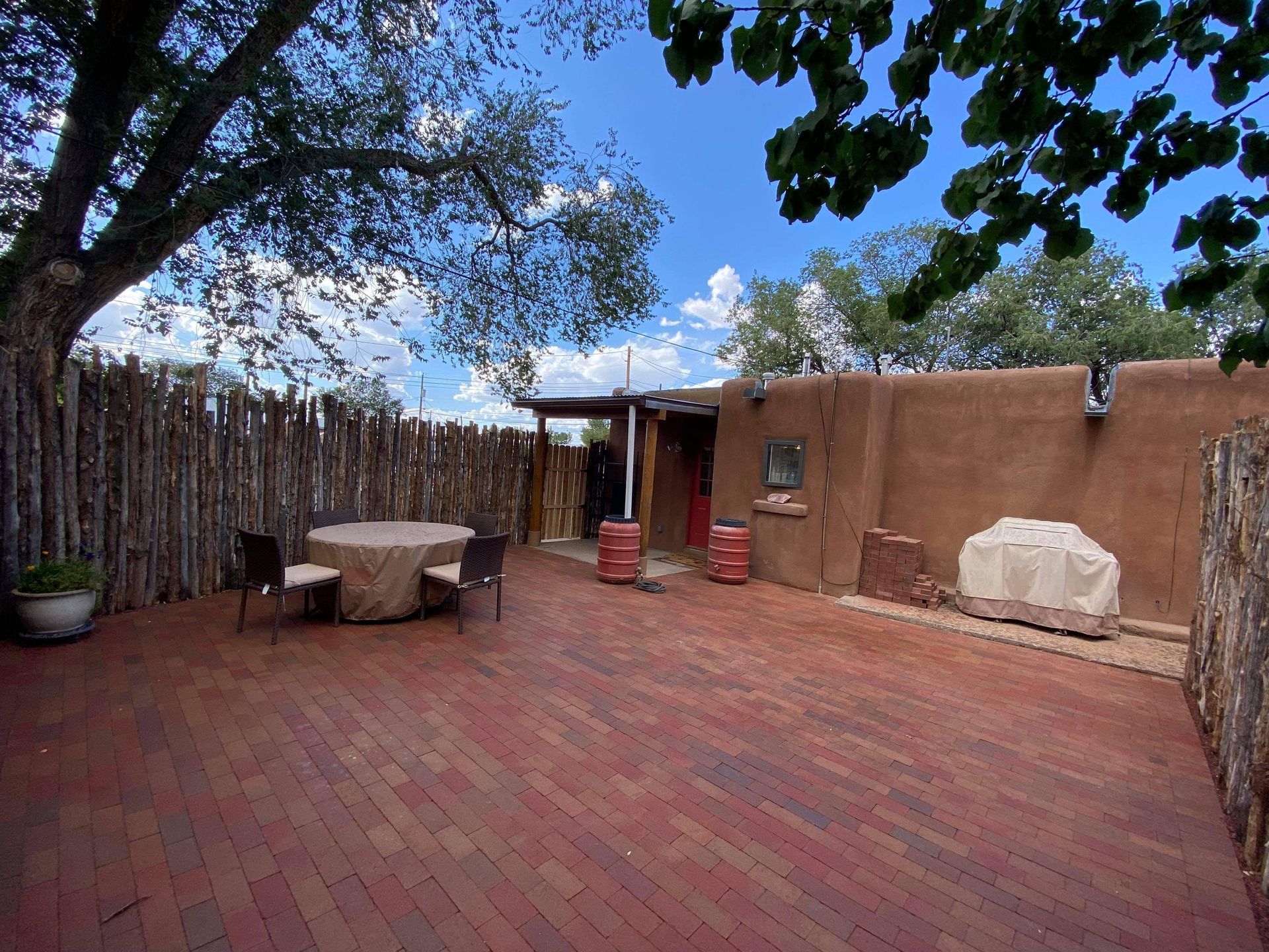 Brick courtyard patio installation for outdoor living space in Santa Fe NM