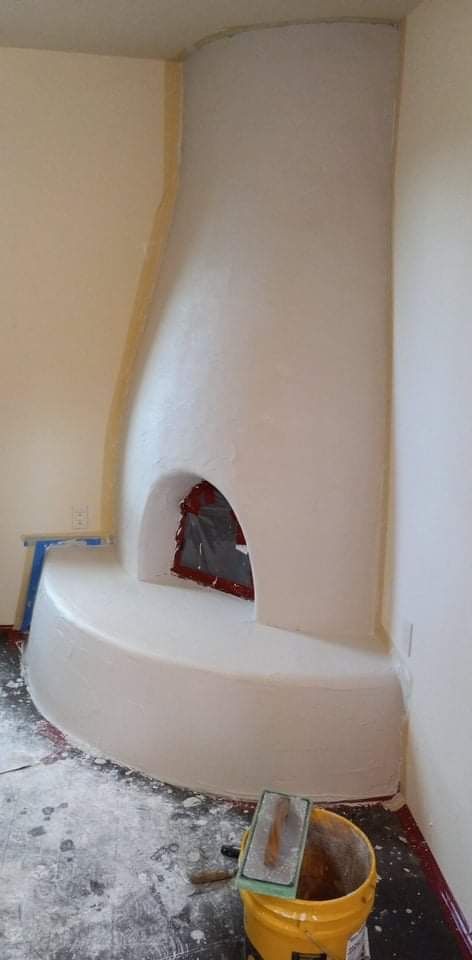 Kiva fireplace remodel in Santa Fe NM with diamond plaster and custom color finish