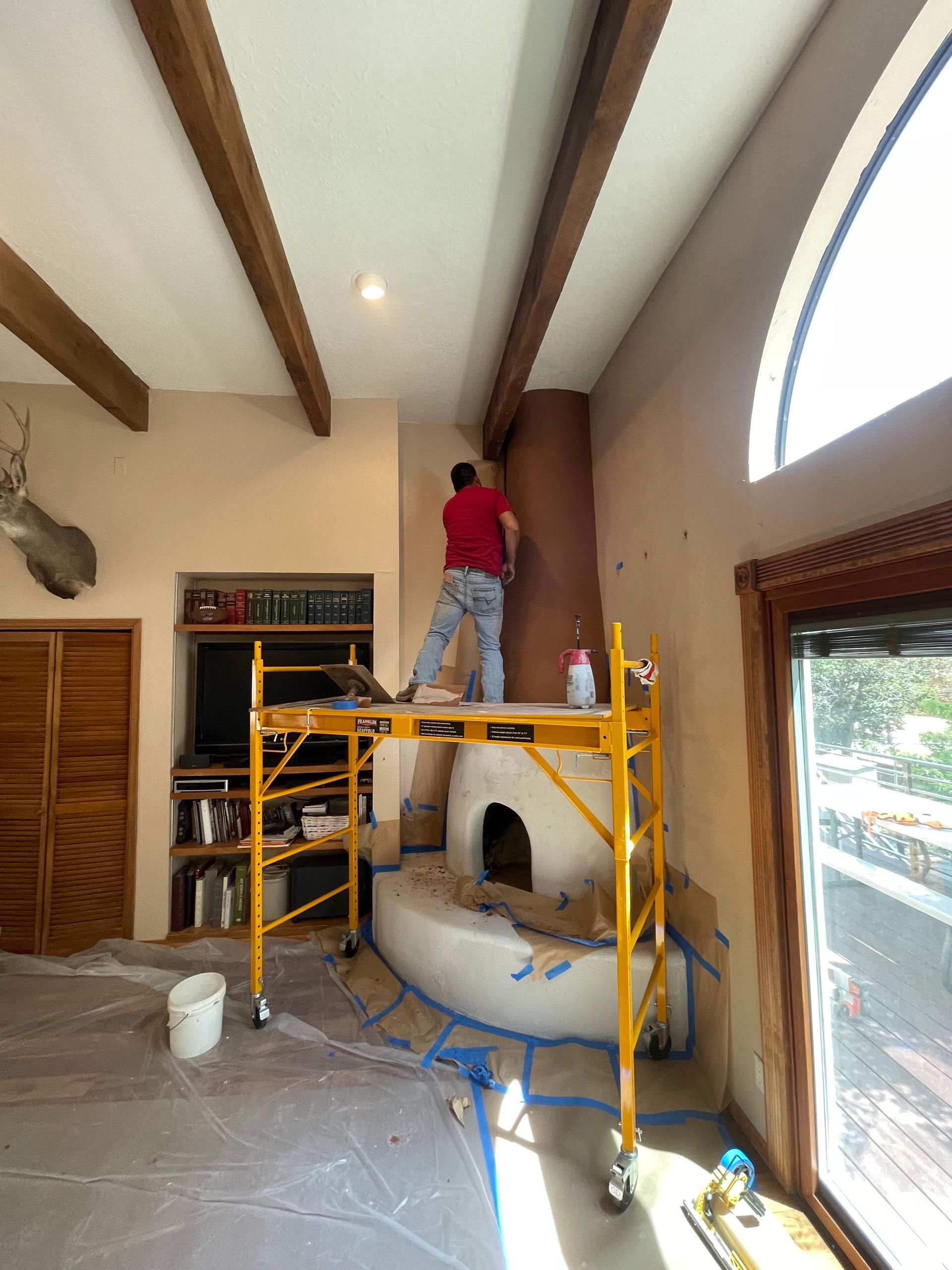 Custom color kiva fireplace with diamond plaster finish in Santa Fe NM remodel