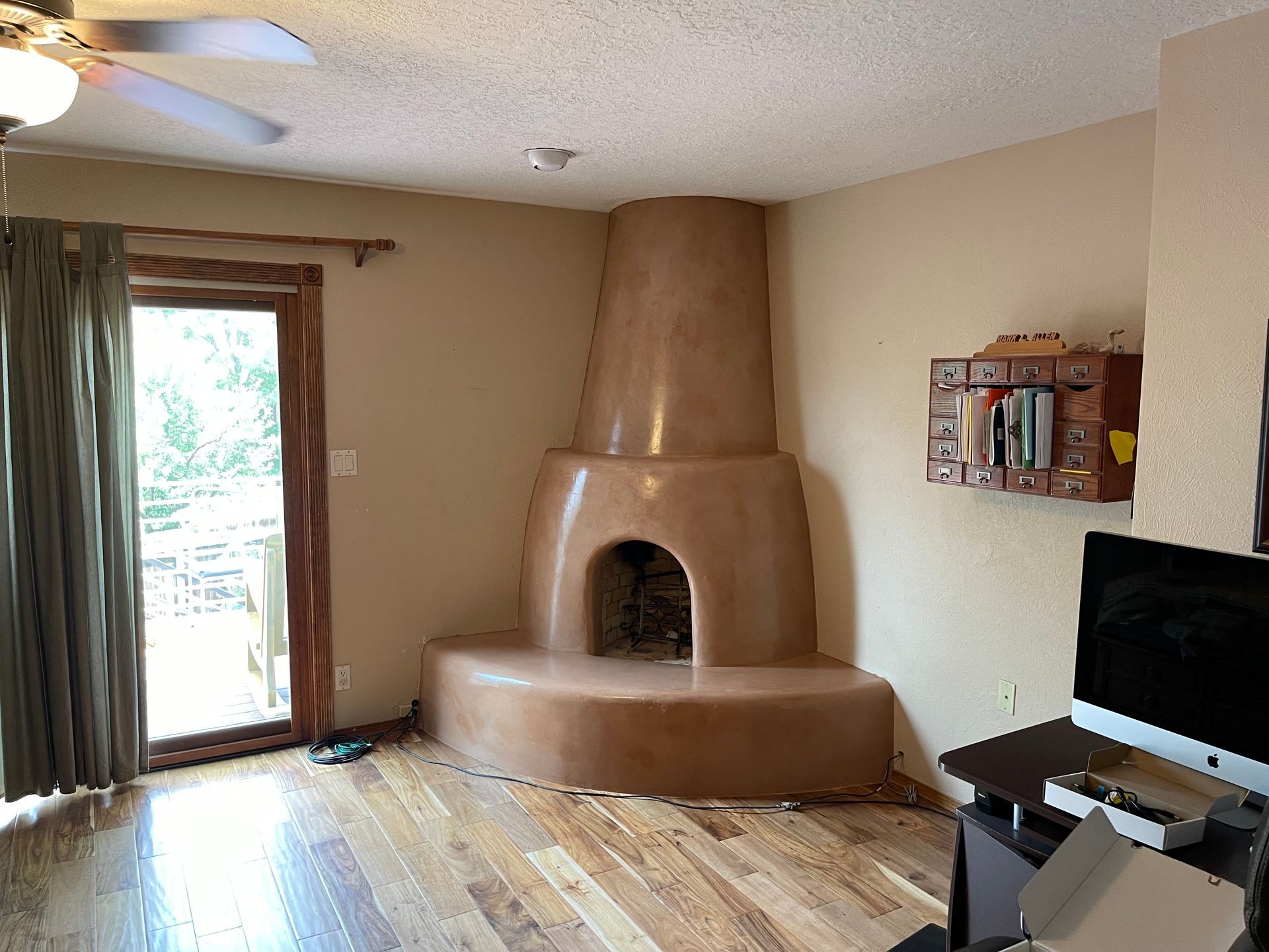Kiva fireplace with diamond finish plaster and custom color in Santa Fe NM home
