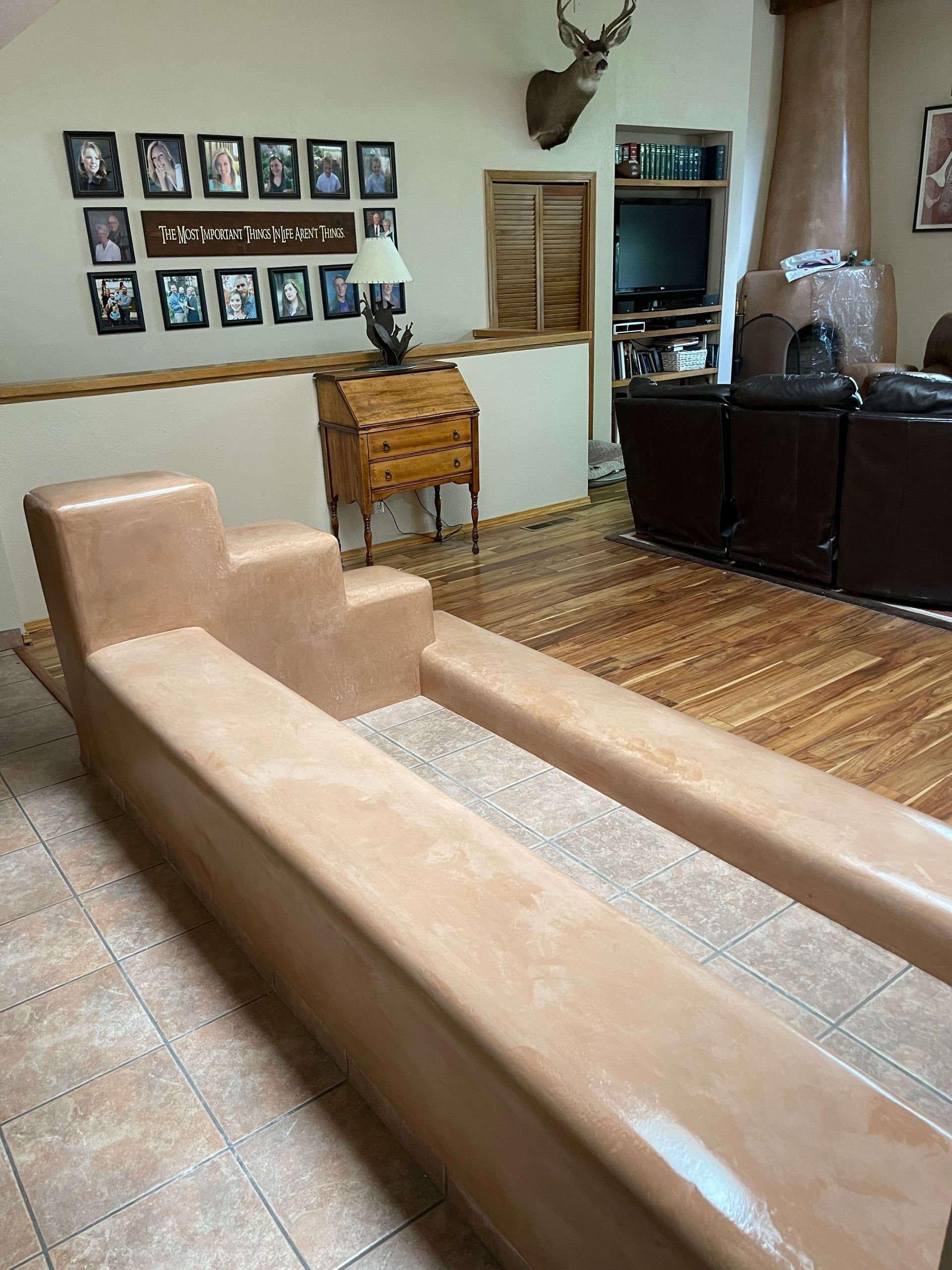 Diamond finish plaster renovation of kiva fireplace in Santa Fe NM hom