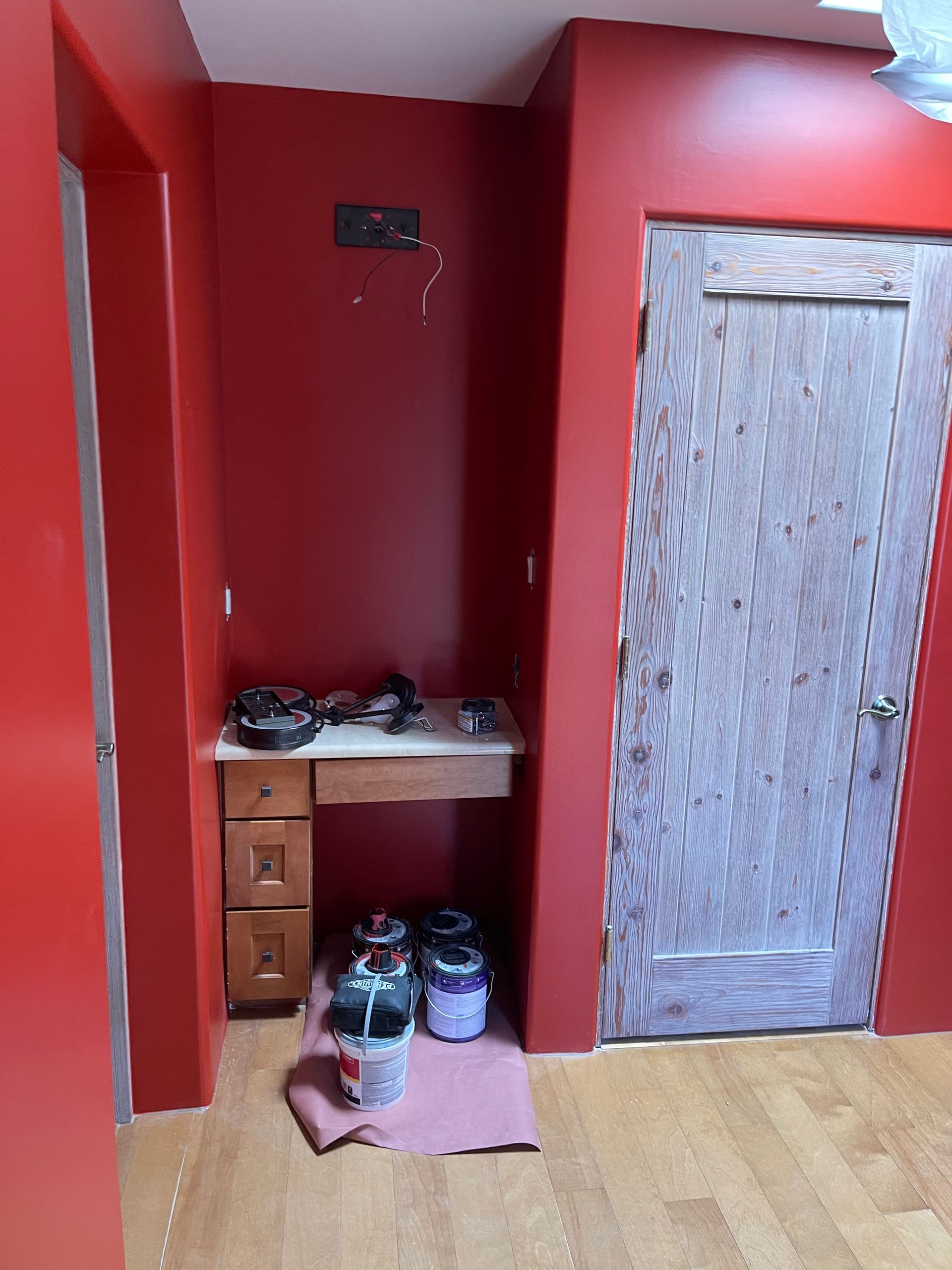 Interior painting with custom red finish in Santa Fe NM home remodel
