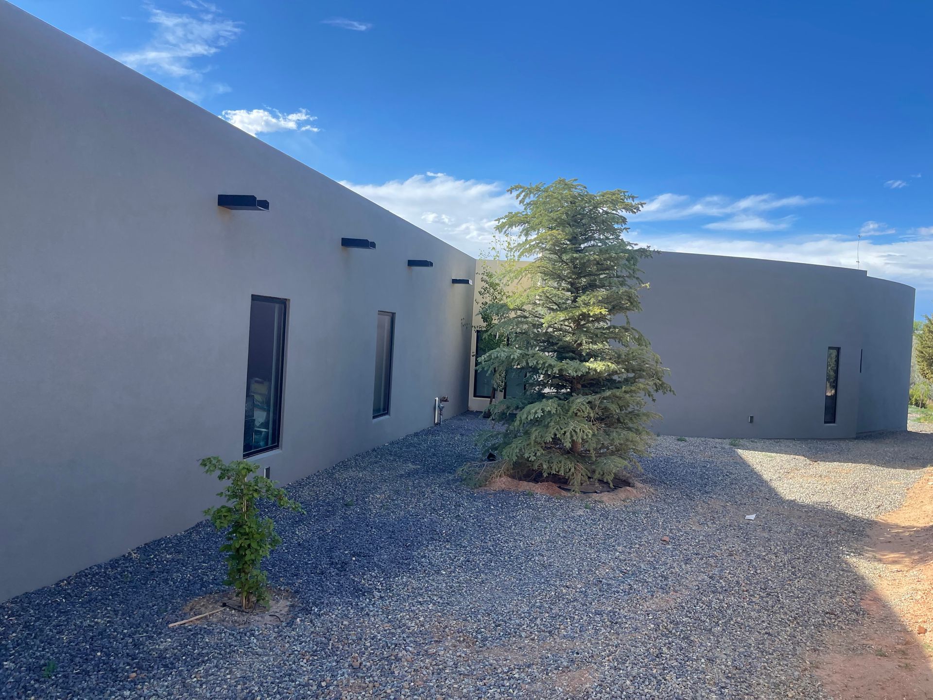 Newly finished home exterior with STO synthetic stucco color coat in Santa Fe NM by Santa Fe R&R