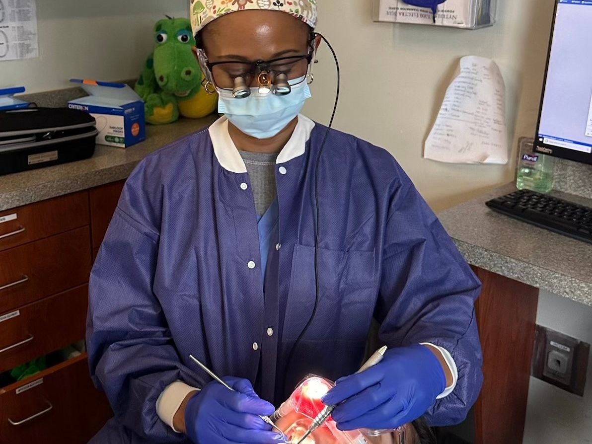 Best Pediatric Dentist working on a kid at Next Level Pediatric Dentist Smiling | Tarrytwon NY 10591 | Spanish Speaking 