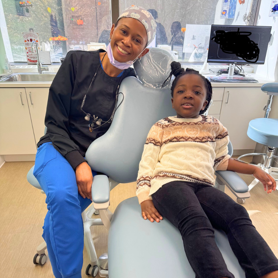 Dr Mensah, a pediatric dentist in Tarrytown NY, with a patient on the autism spectrum, special needs dentistry