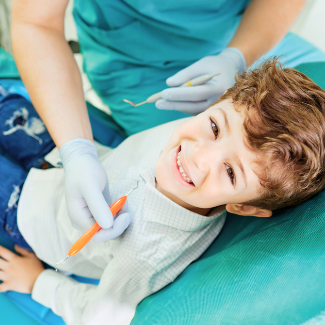 Young boy with Autism smiling during his pediatric dentist appointment, special needs dentistry in Tarrytown NY
