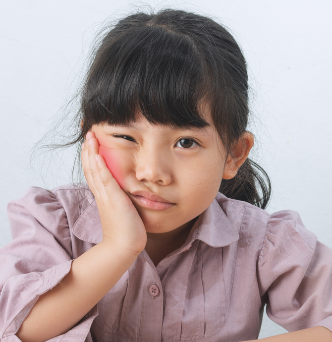 A young child with a toothache, emergency pediatric dentist in Tarrytown NY