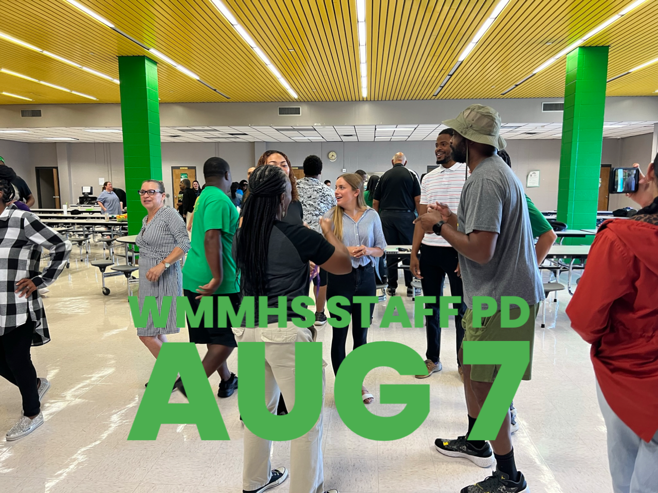 A group of people are standing in a room with the words aug 7 on the bottom
