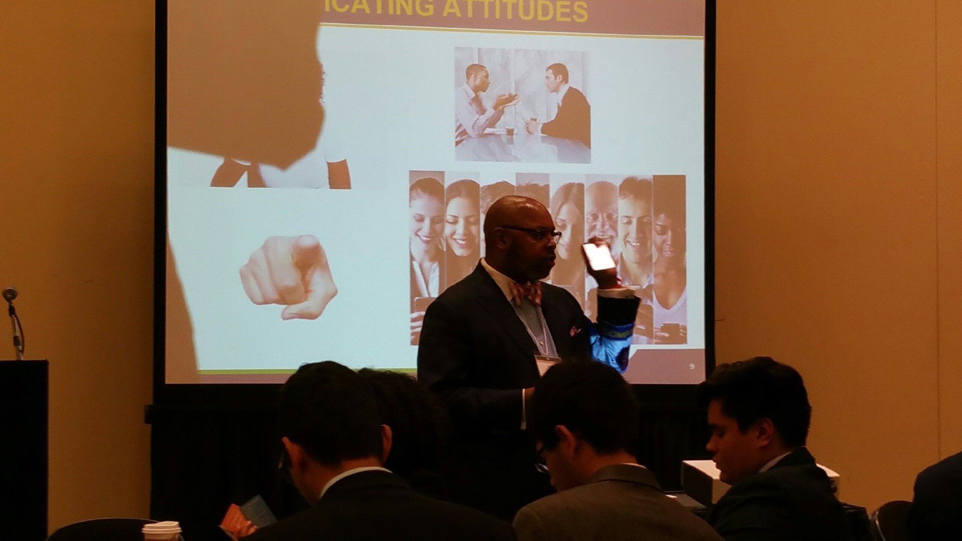 A man is giving a presentation to a group of people