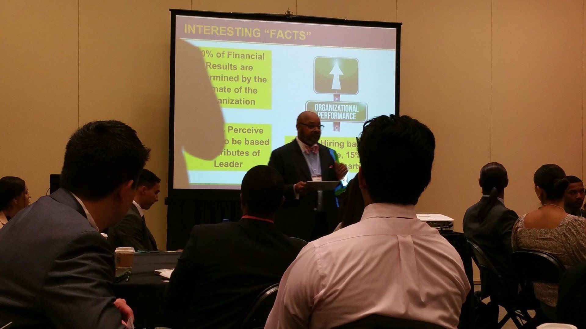 A man is giving a presentation to a group of people