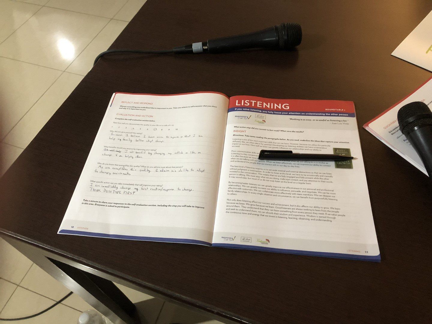 A book is open to a page that says listening