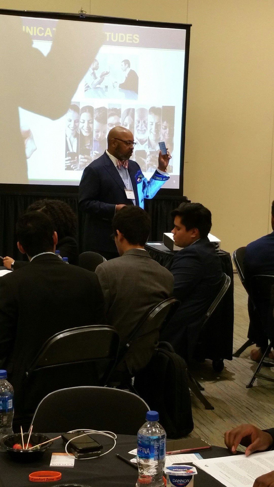 A man is giving a presentation to a group of people