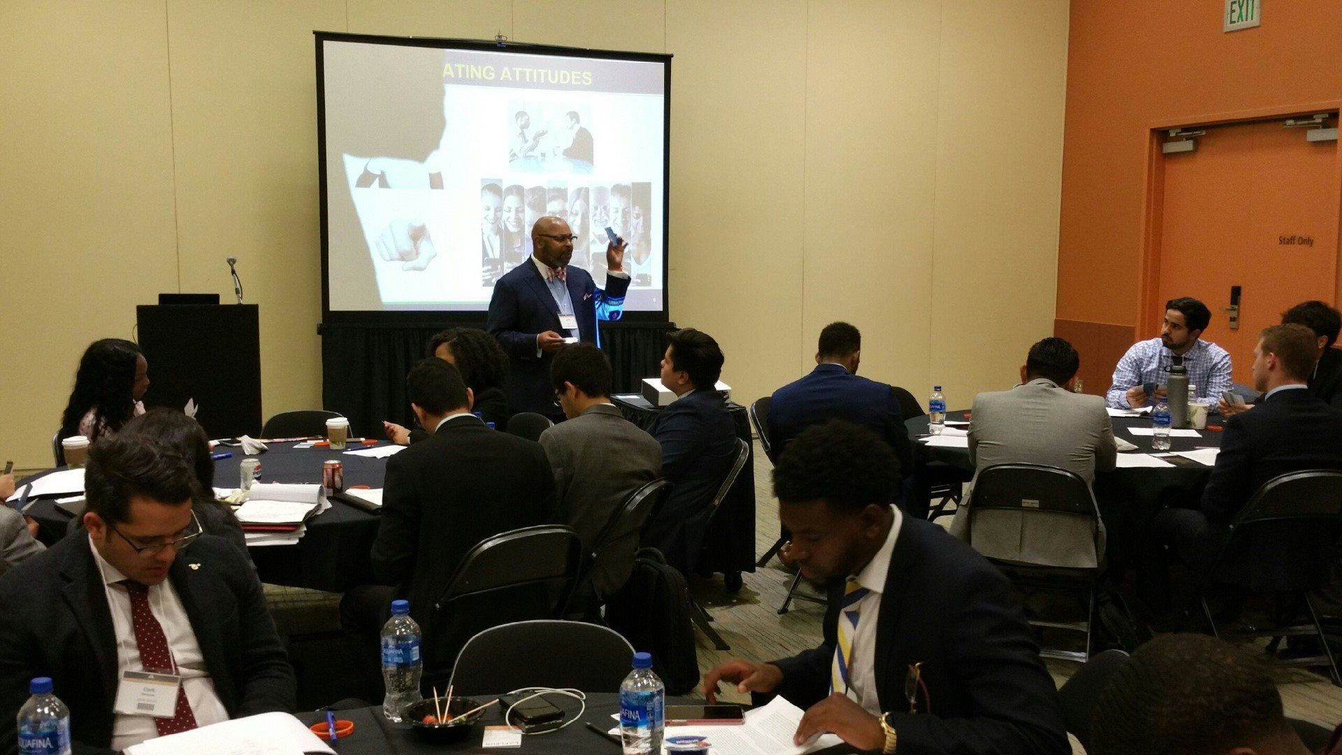 A man is giving a presentation to a group of people