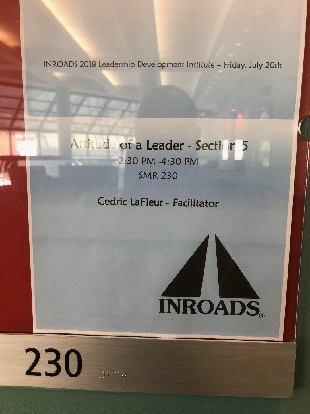 A sign on a wall that says inroads on it