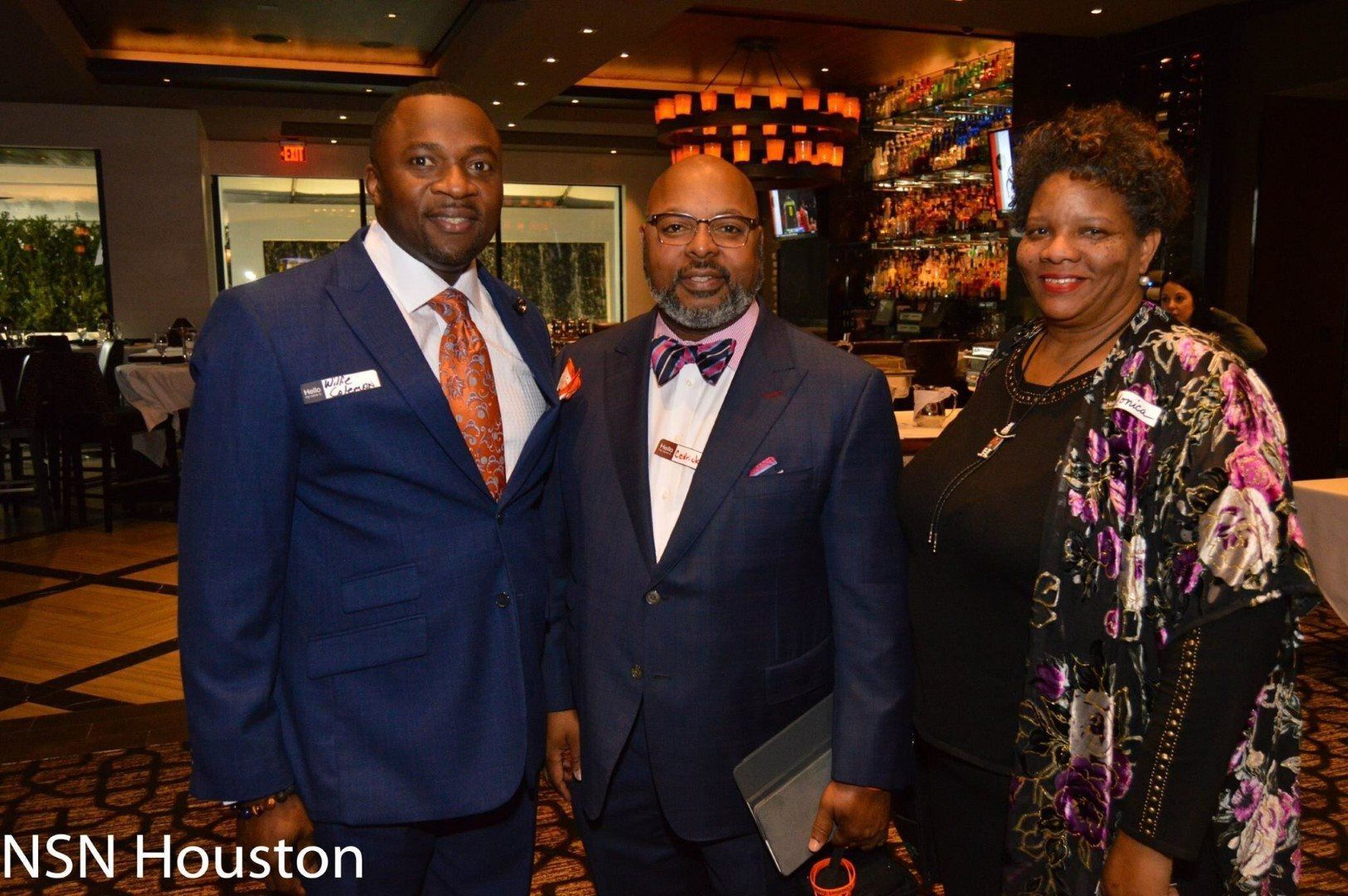 A group of people posing for a picture with nsn houston written on the bottom
