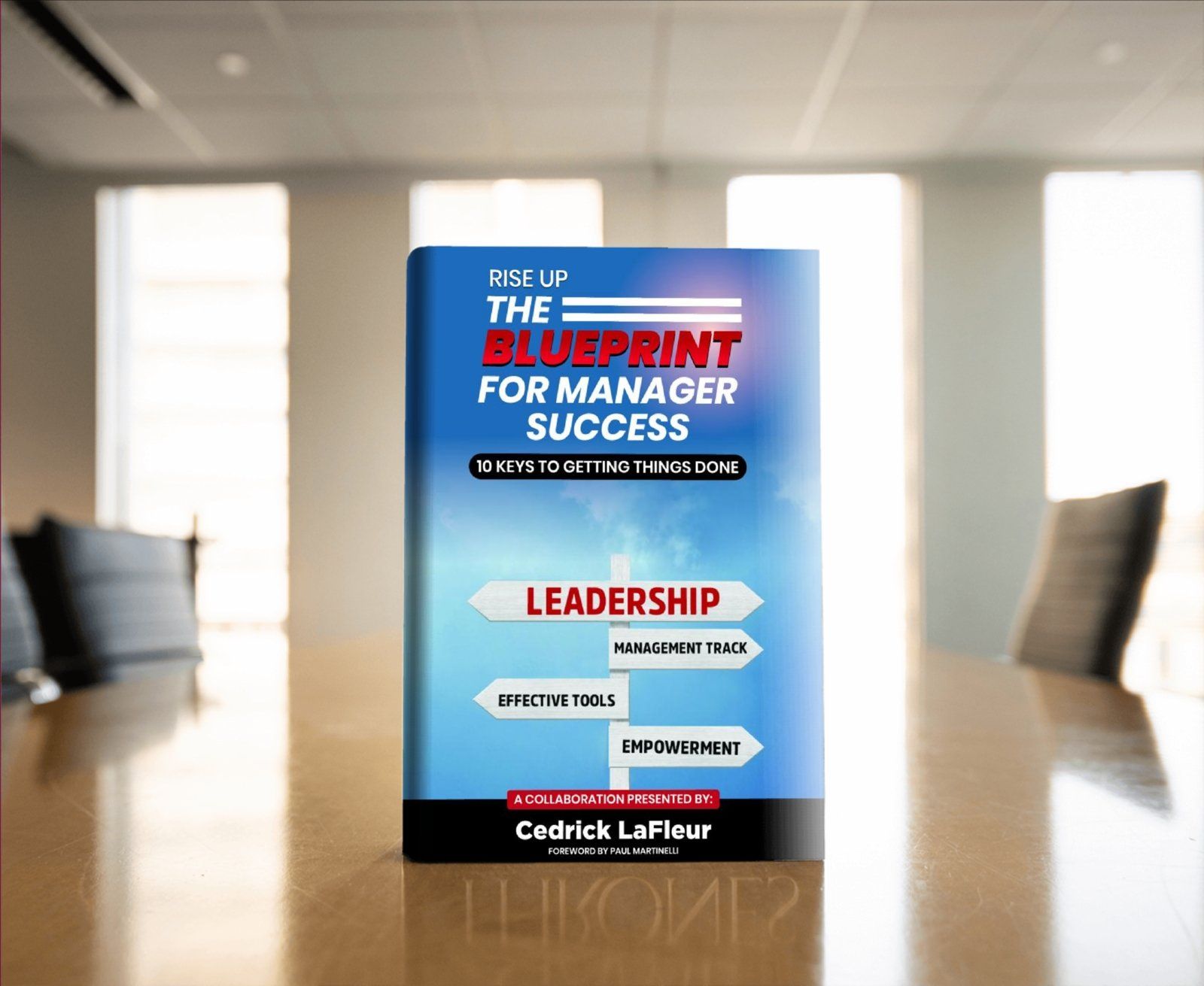 A book titled pick up the blueprint for manager success