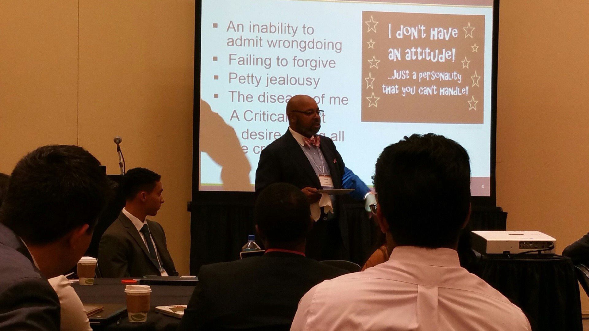 A man is giving a presentation to a group of people